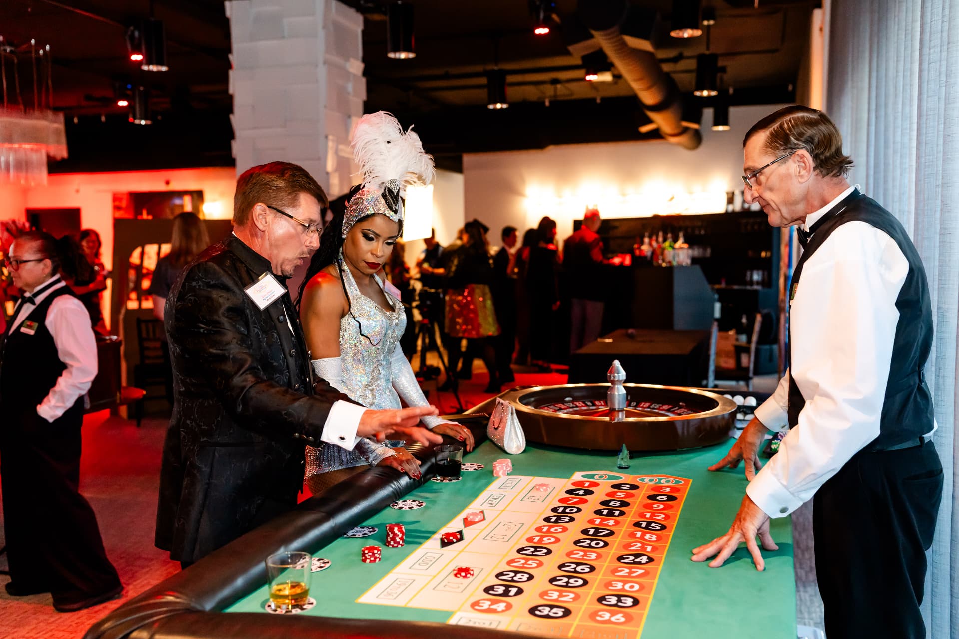 Guests playing roulette during a casino-themed company party at The MEZZ